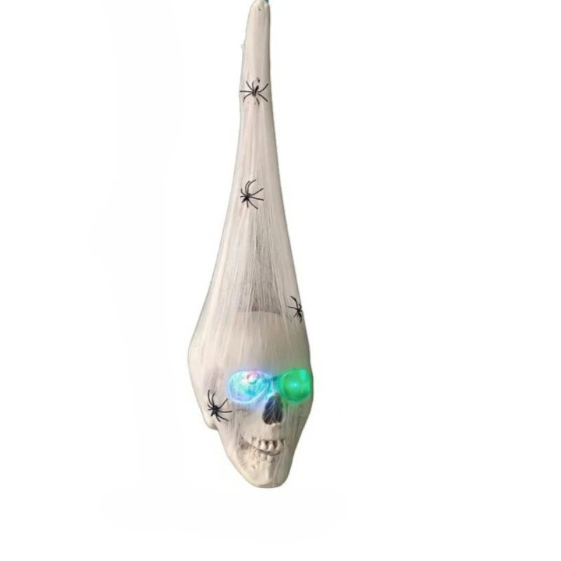 A white skull decoration featuring glowing spider webs and light-up eggs.