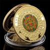 A gold-plated commemorative coin of the Mayan Calendar featuring intricate designs and text.
