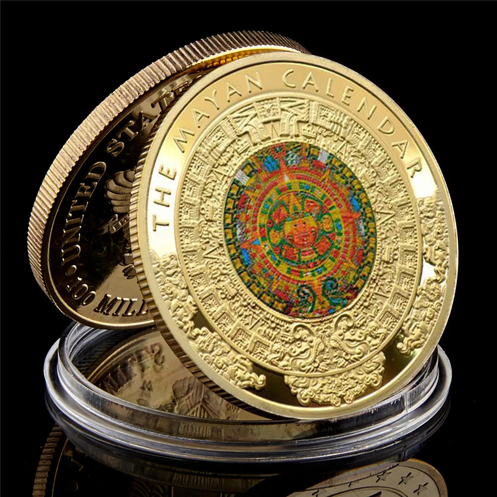 A gold-plated commemorative coin of the Mayan Calendar featuring intricate designs and text.