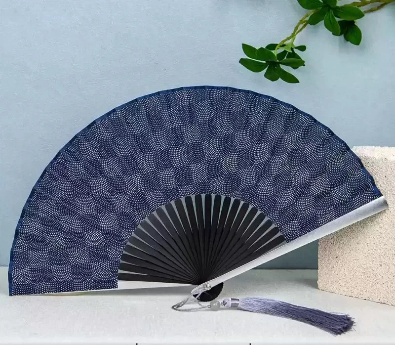 A dark blue patterned titanium alloy folding hand fan is displayed against a light blue background.