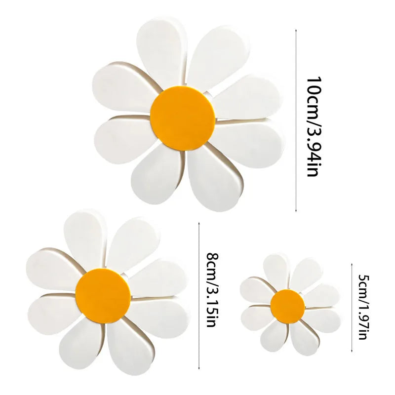Set of three white and orange wooden daisy flower ornaments with size measurements.