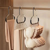 A set of five non-slip wall-mounted hooks for organizing baseball caps, displayed against a light wood background.