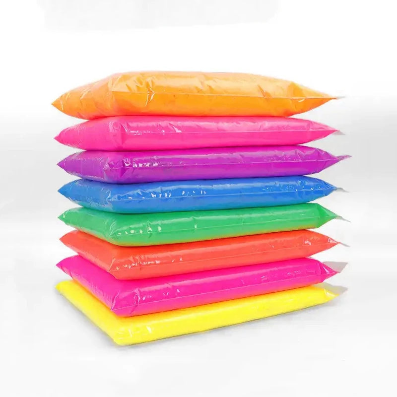A set of thirteen vivid neon fluorescent pigment powders in various colors laid out horizontally.