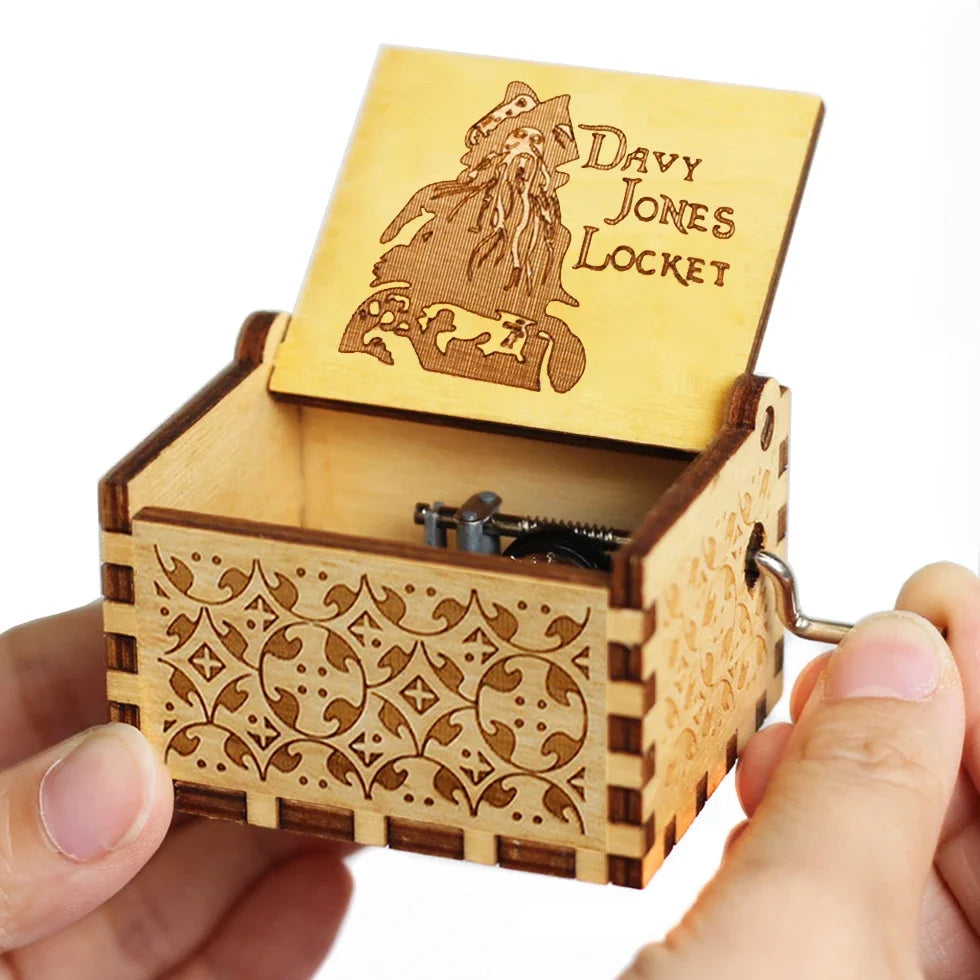 A carved wooden music box with a lid featuring a silhouette of a figure and intricate wood carving details.