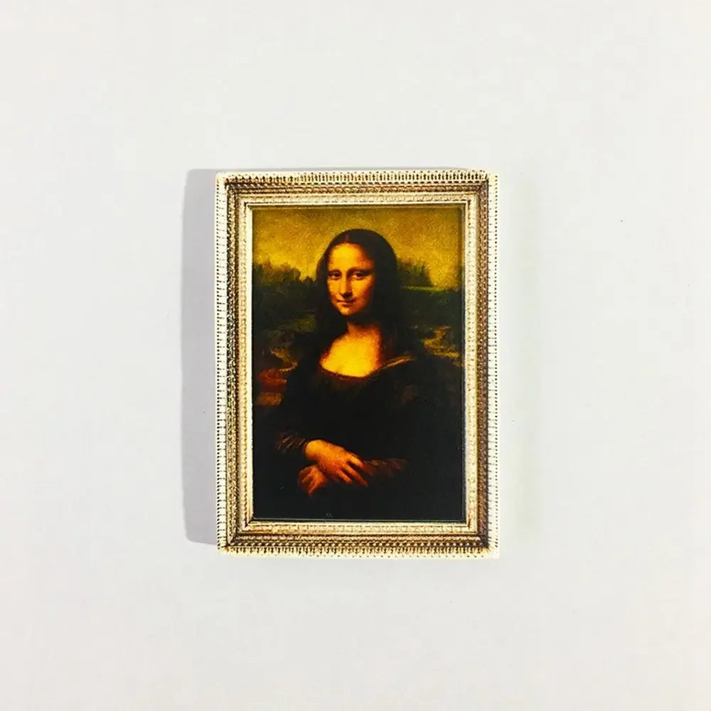 A framed painting of a woman in dark clothing against a golden background, used as decor.