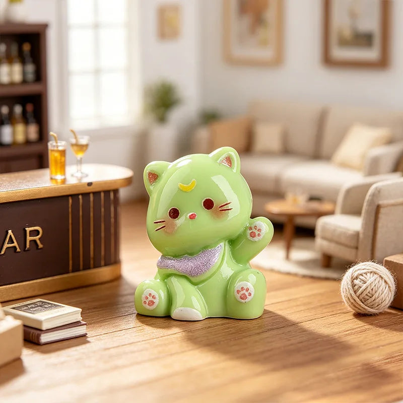 A cute, lime green 3D resin cat keychain with purple accents sitting on a wooden table.