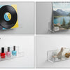 Four clear acrylic floating shelves displaying vinyl records, magazines, and figurines.