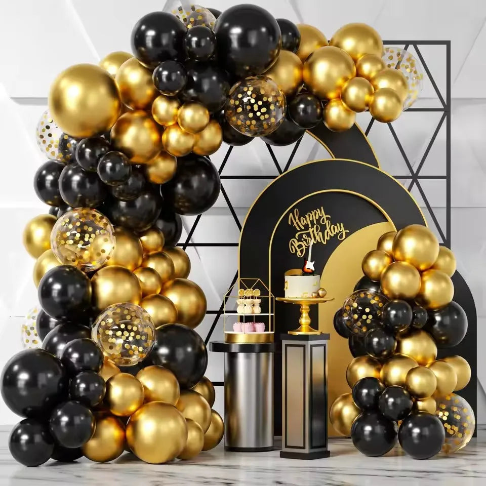 A large balloon arch display featuring black and gold latex balloons for parties.