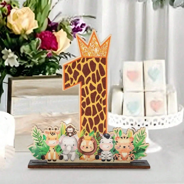 A wooden party ornament shaped like the number one with a crown and jungle animals.