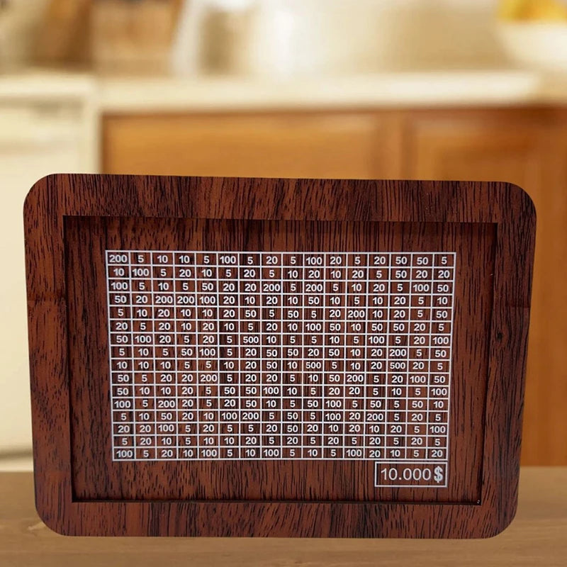 A wooden savings box with a progress tracker showing various dollar amounts.