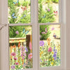 Window decal featuring colorful butterflies and flowers in a garden setting