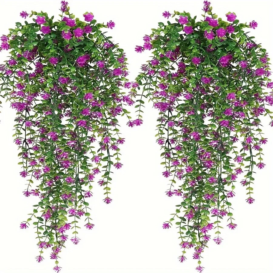 A set of three lifelike faux eucalyptus hanging plants with vibrant green leaves and purple flowers.