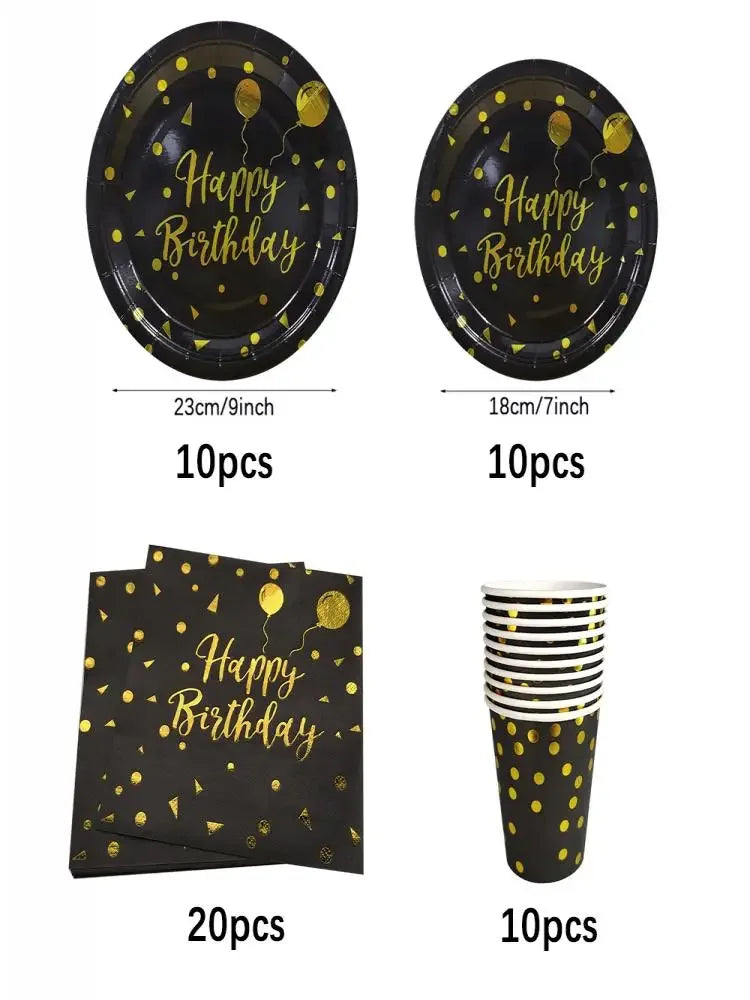 A set of black and gold disposable dinnerware including plates and cups with a happy birthday design.