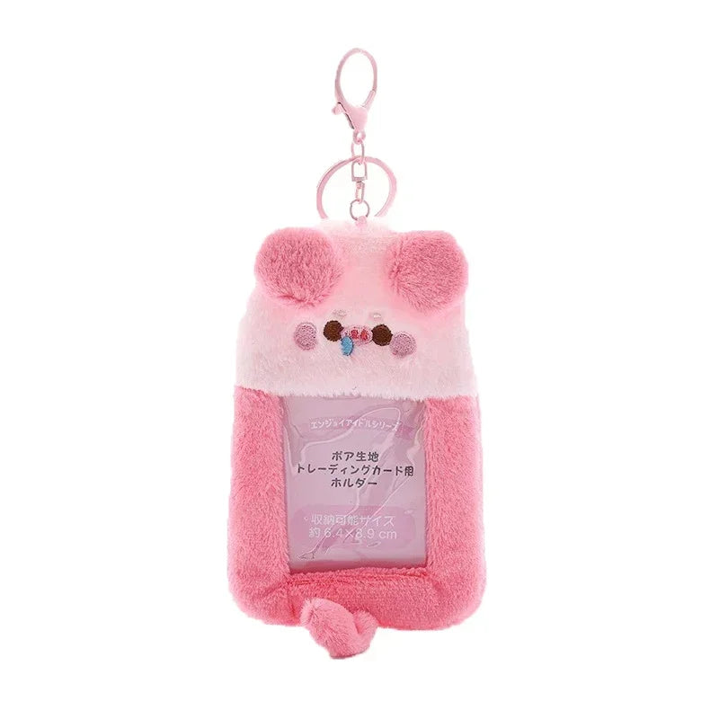 Pink fluffy bear keychain with a clear plastic holder for photocards