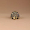 Antique brass crocodile figurine with detailed texture, used as vintage desk decor.