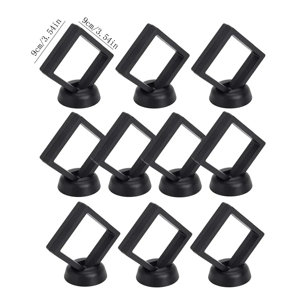 A set of ten black floating shadow box jewelry display frames with 9cm/3.54in openings.