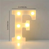 A glowing letter F made of LED lights, illuminating a surface.