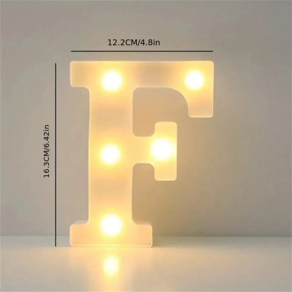 A glowing letter F made of LED lights, illuminating a surface.