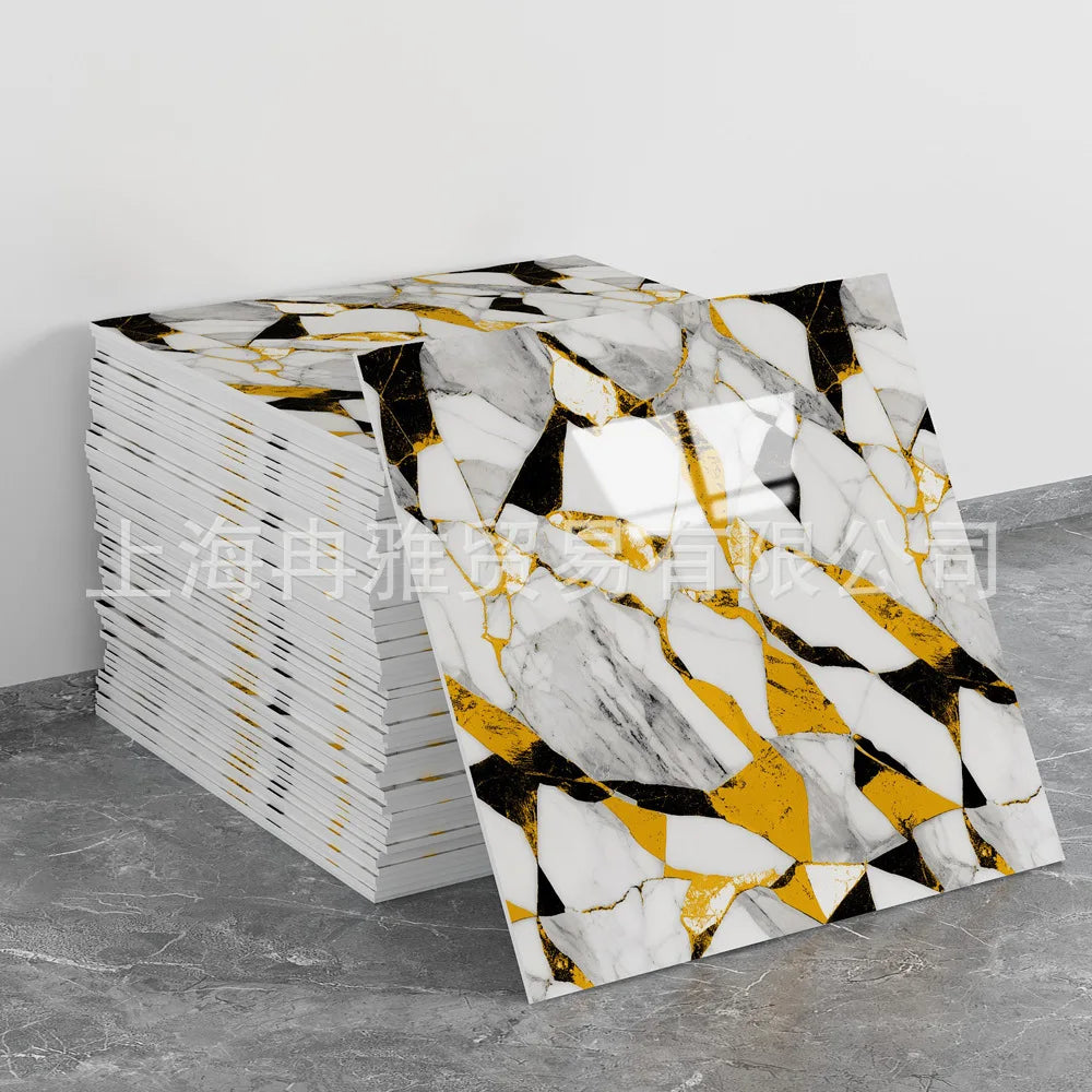Stack of faux marble 3D self-adhesive wall tiles featuring black and white veining with gold accents