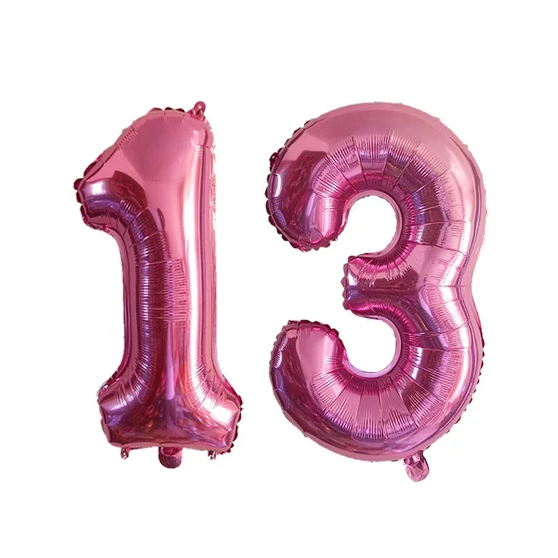 Two pink foil number balloons forming the number 13