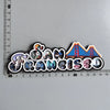 A set of fridge magnets featuring iconic scenes and landmarks from San Francisco, including the Golden Gate Bridge and city v