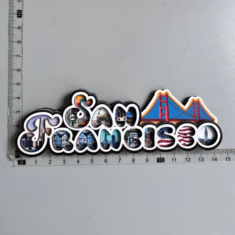 A set of fridge magnets featuring iconic scenes and landmarks from San Francisco, including the Golden Gate Bridge and city v
