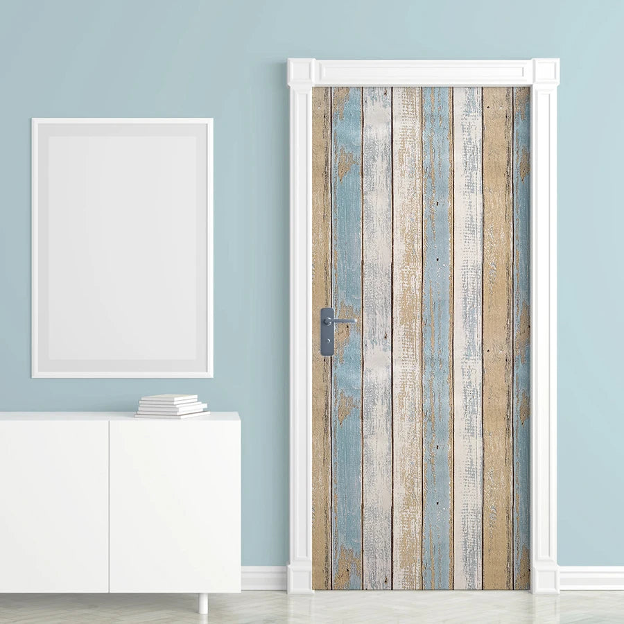 Rustic faux wood peel-and-stick wallpaper featuring vintage blue and white plank design on a door.