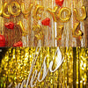 Gold and red metallic foil fringe curtain with the text LOVE YOU 13