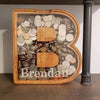 Alphabet wooden piggy bank coin box shaped like the letter B made of coins
