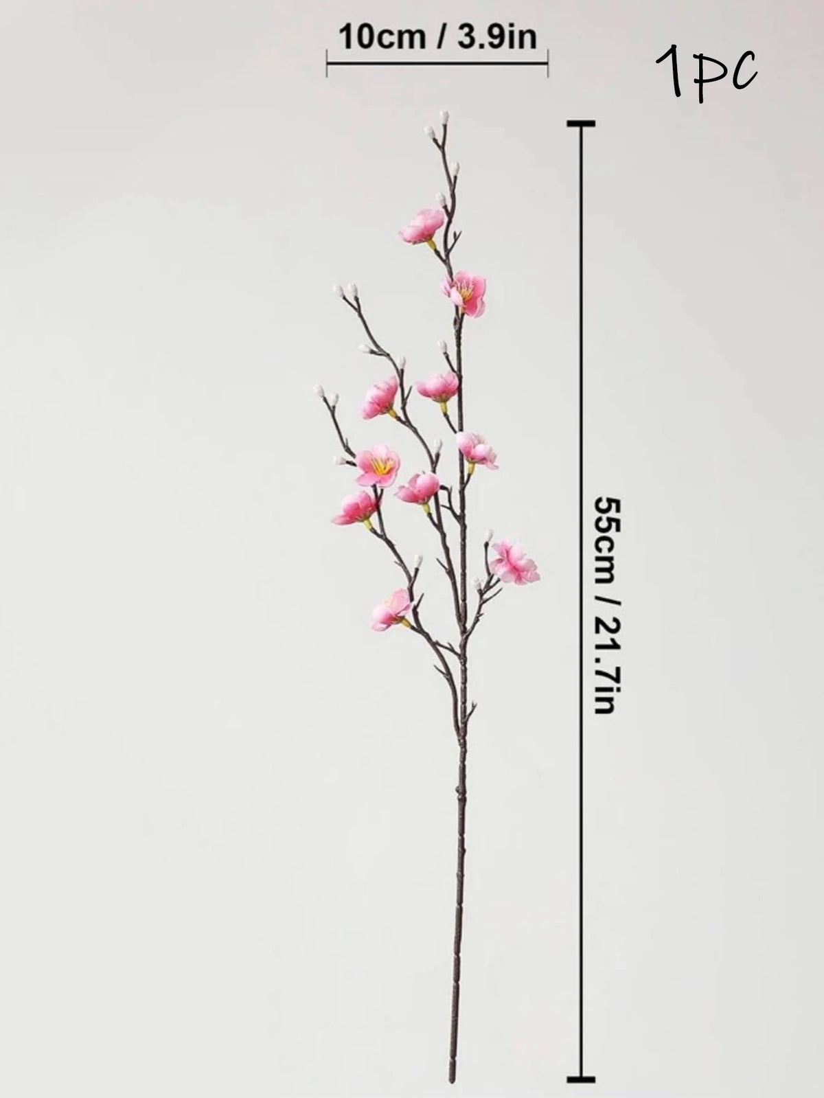 Una rama vertical de flores de ciruela artificial rosa en un tallo oscuro, mostrada con una marca de escala.