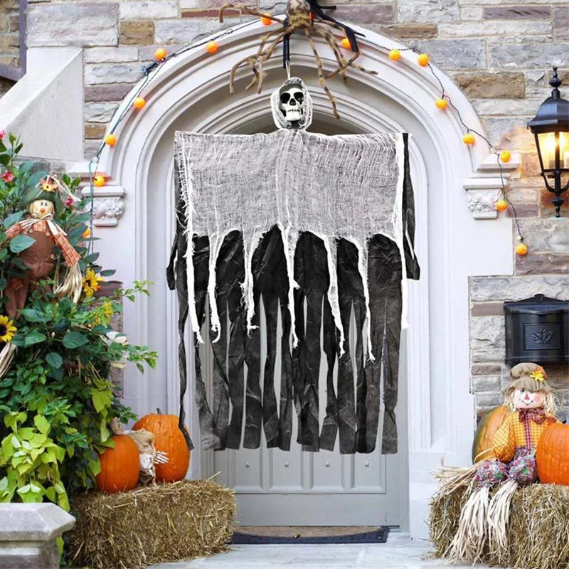 A spooky Halloween decor set featuring a hanging ghost and skeleton silhouette on a white door.