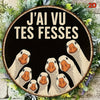 A circular wooden sign featuring multiple stylized duck heads with the text J'ai vu tes fesses