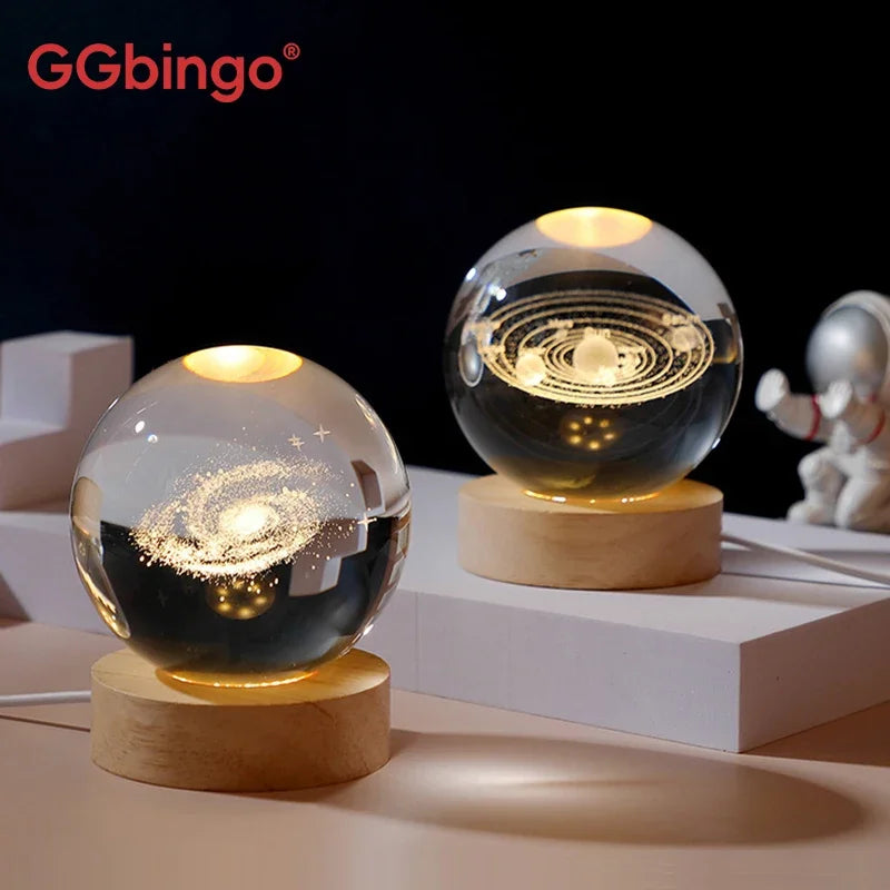Galaxy crystal ball night light with a glowing sphere on a wooden base