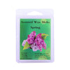 A package of Spring scented wax melts with a green label showing the scent description and weight.