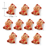 Un set de lindos imanes navideños para nevera con figuras pequeñas y redondas en tonos marrón rojizo y dorado.