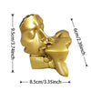 Gold resin sculpture of a kissing couple with detailed facial features