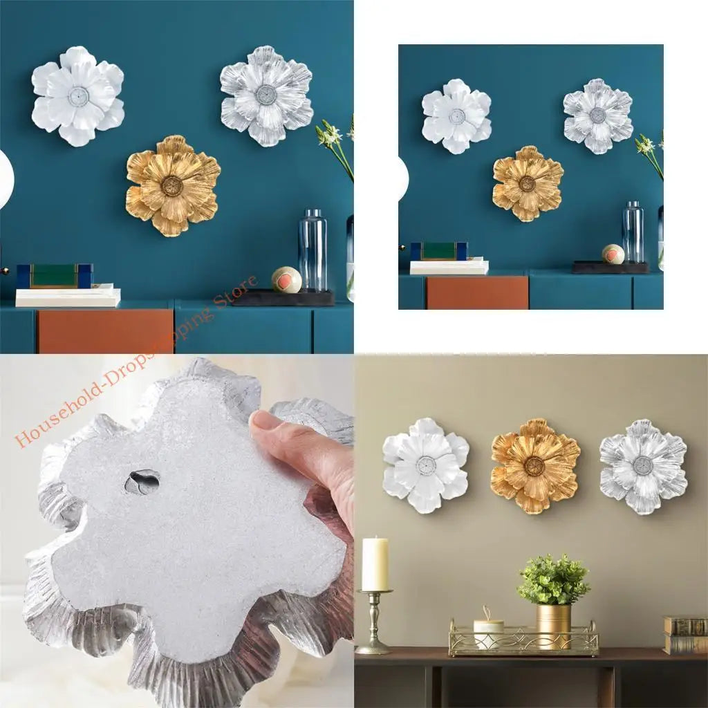 Layered resin floral wall decor featuring white and gold flowers displayed on a teal wall.