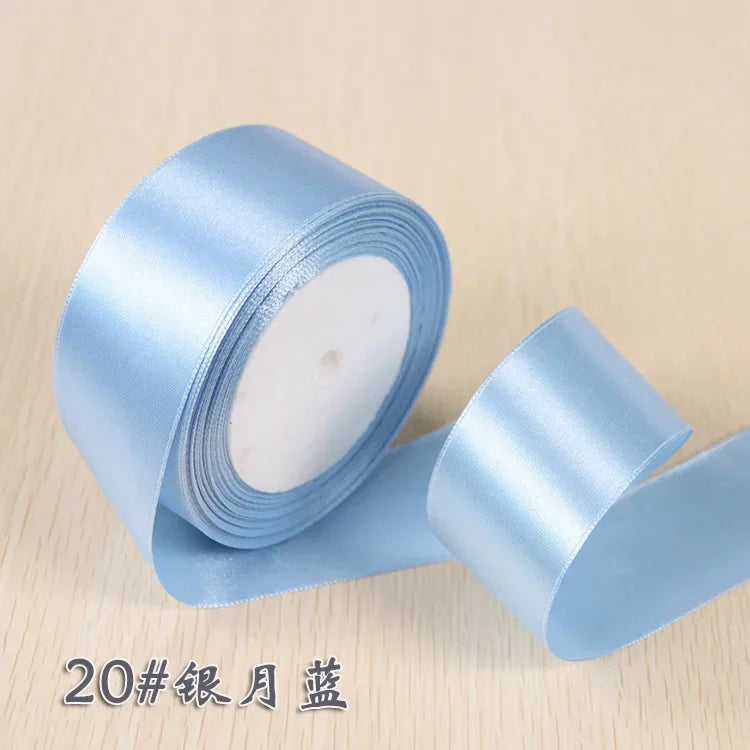 Roll of light blue silk satin ribbon for gift wrapping and craft projects