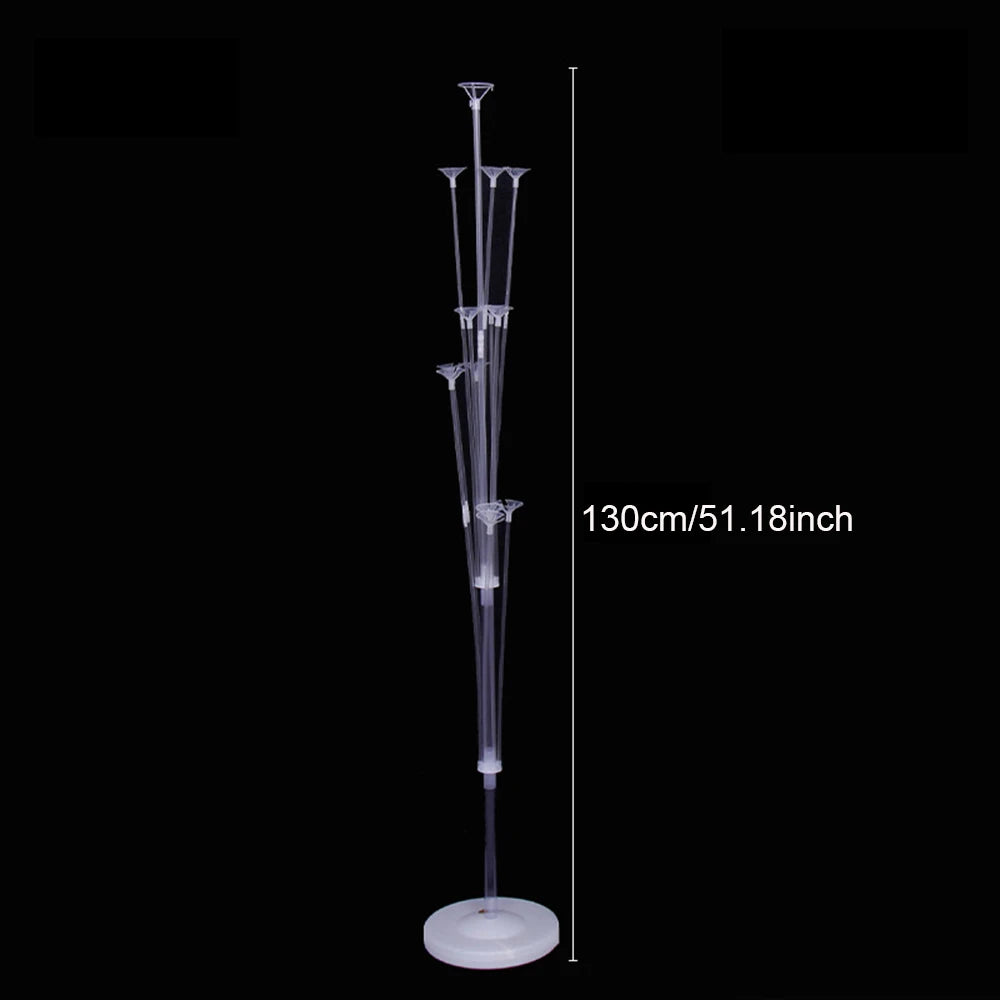 A clear balloon stand kit with a pole and base for party decorations, shown against a black background.