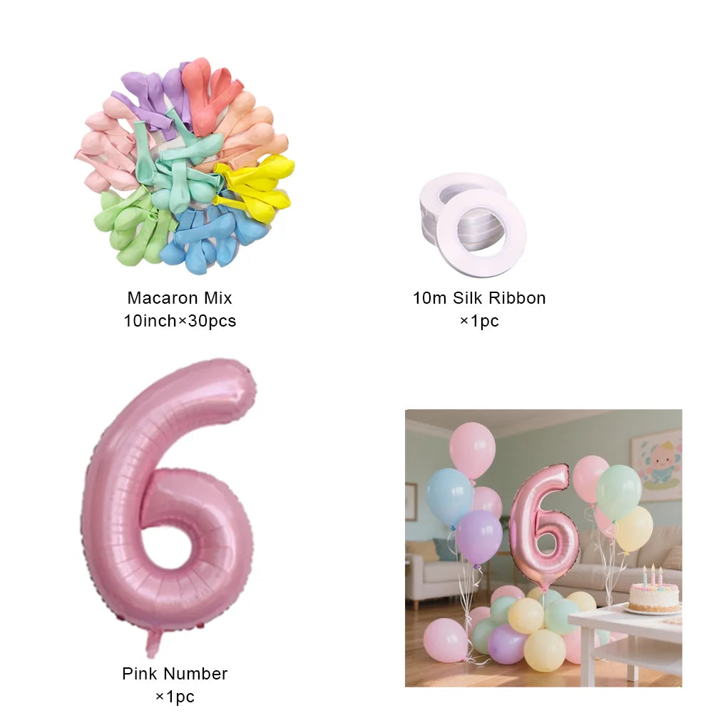 Un ensemble de ballons en feuille rose en forme de six et diverses rubans de soie colorés.