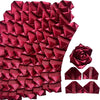 A dense arrangement of deep red satin ribbon rose petals for DIY flower bouquets.