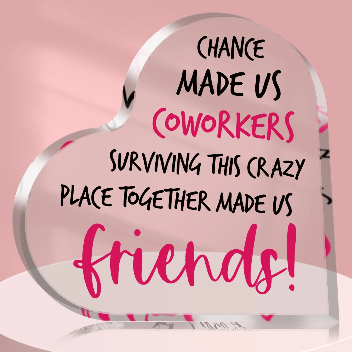 A heart-shaped plaque with pink text that reads Chance made us coworkers surviving this crazy place together made us friends