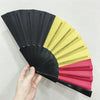 A handheld folding fan featuring a design inspired by the country flag, shown partially opened.