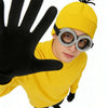 A person wearing a yellow knitted hat, black gloves, and silver-rimmed round glasses.