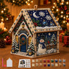 A detailed diamond painting kit of a Christmas cabin house featuring a snowy scene and festive decorations.