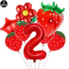 A set of red strawberry shaped balloons and a red number two balloon for a party kit