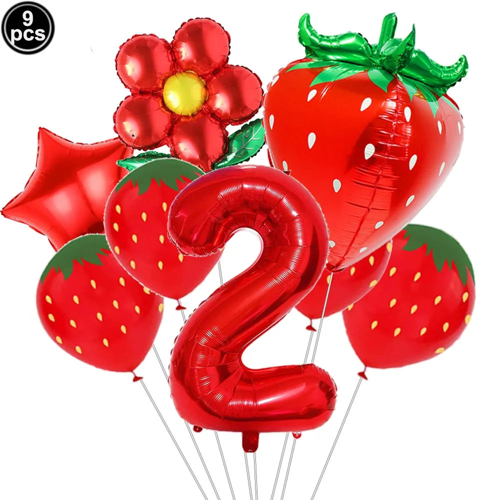 A set of red strawberry shaped balloons and a red number two balloon for a party kit
