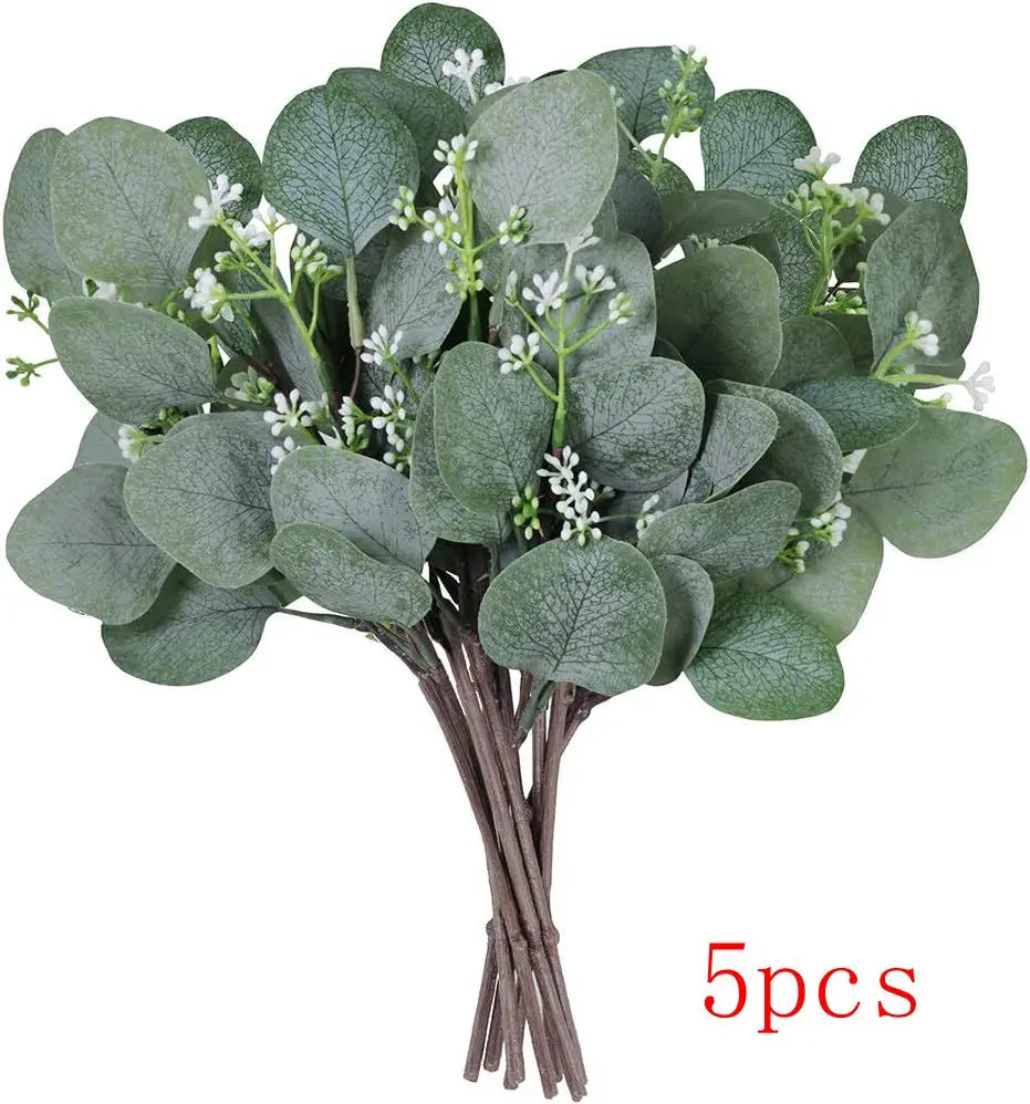 A bundle of artificial eucalyptus stems with small white flowers for home decor