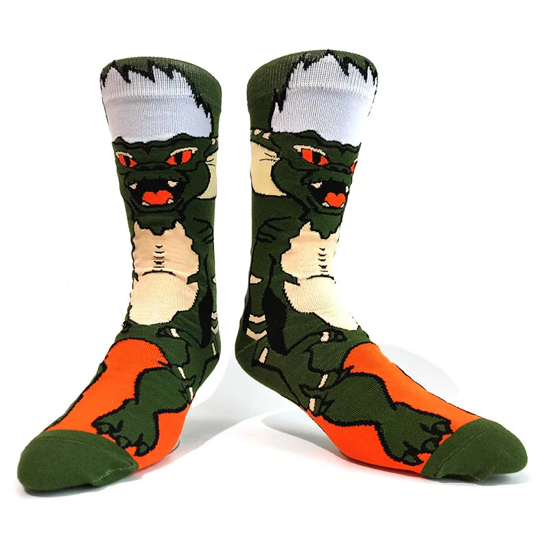 Pair of novelty crew socks featuring green alien and tiger skull prints