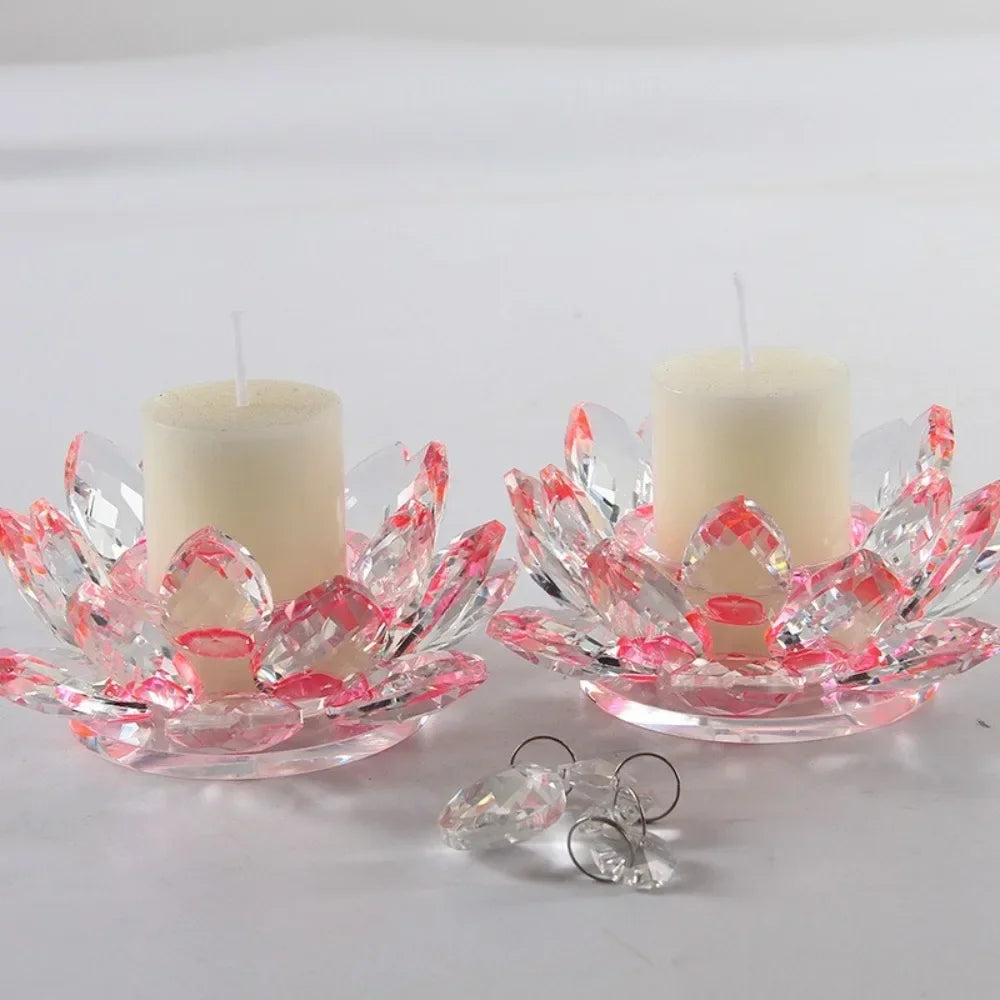 A crystal lotus candle holder with a white candle and pink glass petals.